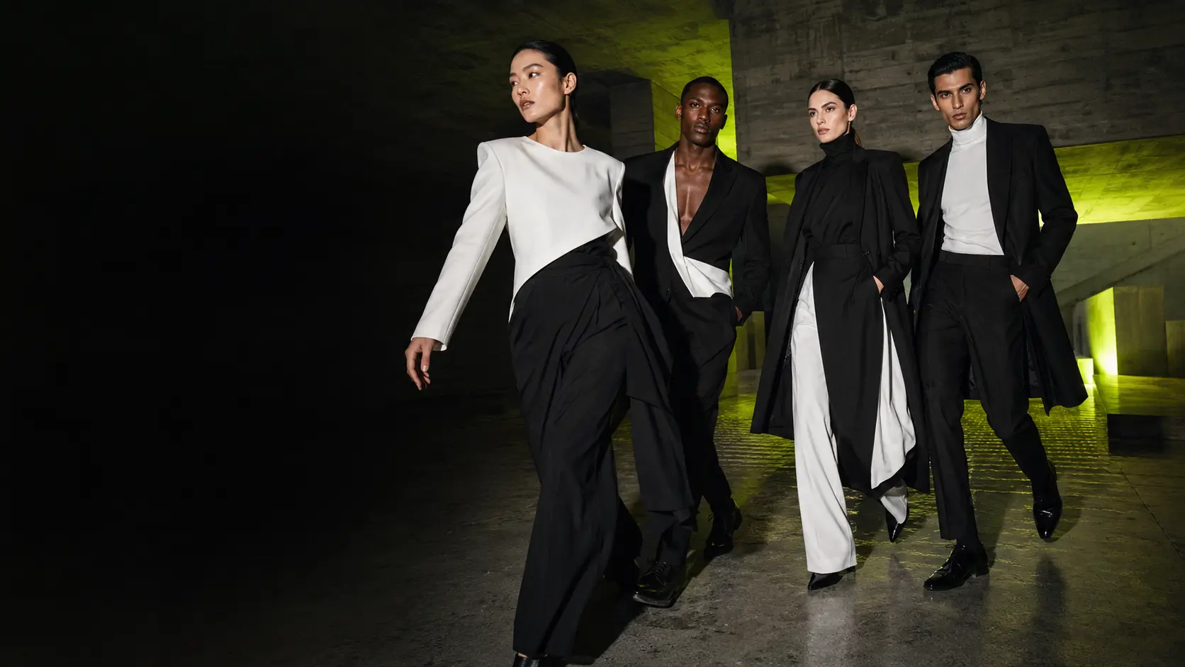 Adult fashion models walking through a cinematic editorial environment